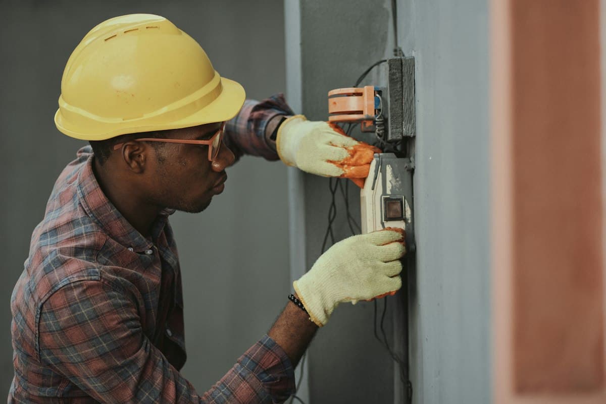 Electrician working on a consumer unit